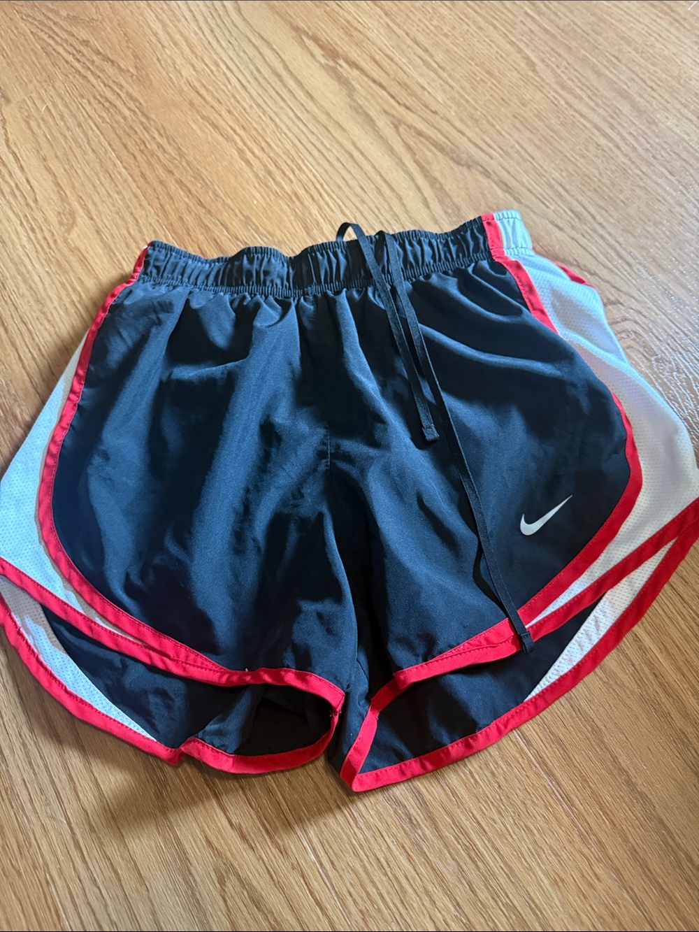 Nike Women’s Black Athletic Shorts with Red and White Accents